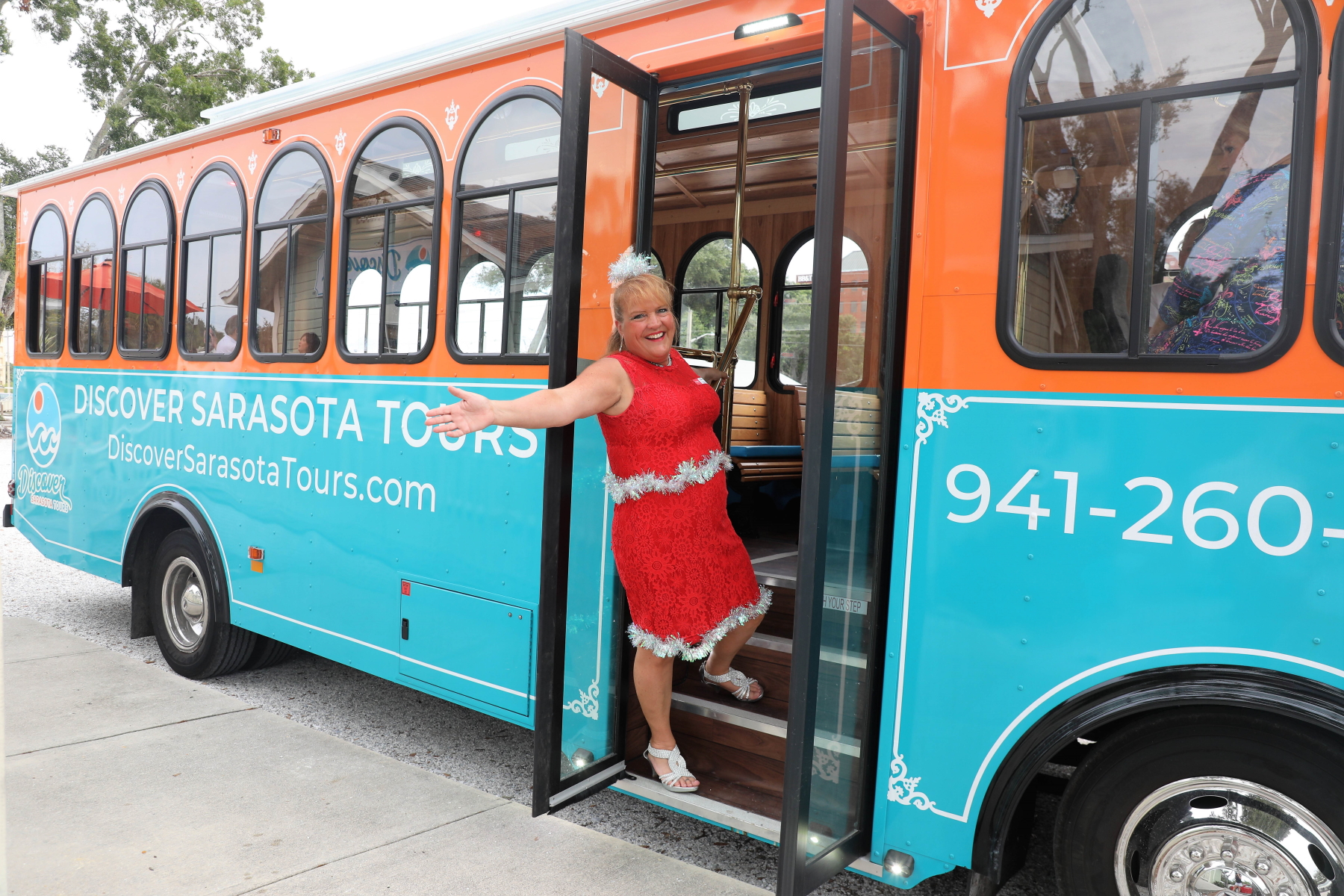 1m9a8656-2_51668632744_o Bernie Nolan standing in front of a bus