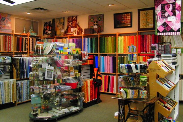 a room with a book shelf filled with books