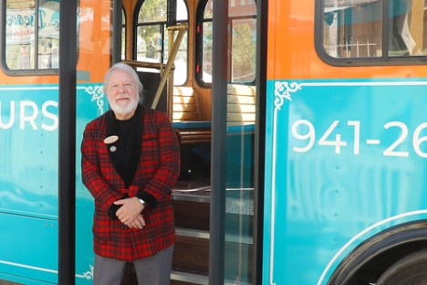 Bob Collins standing in front of trolley