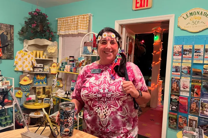 a woman standing in front of a store