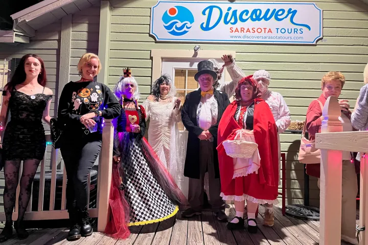 a group of people standing in front of a building