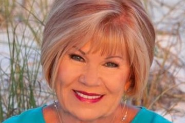 a little girl smiling at the camera