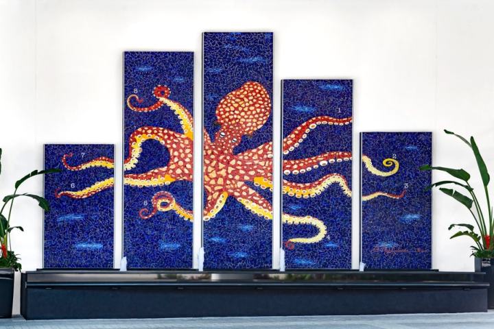 Colorful octopus mural split across five panels with plants on either side.