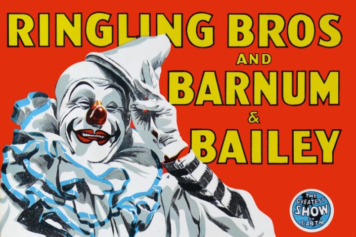 Vintage circus poster with a smiling clown and bold text.