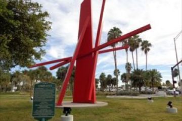 a swing set in a grassy field