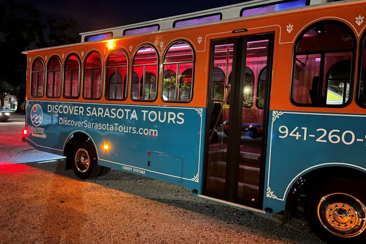 a colorful bus parked in a parking lot