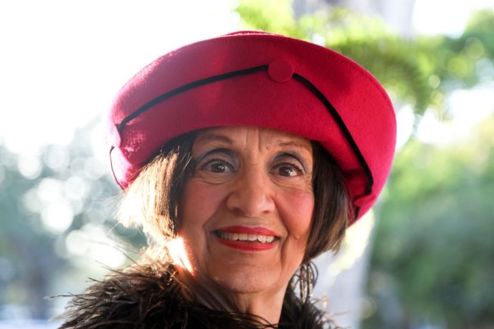 a close up of a person wearing a hat