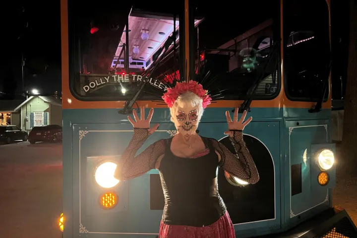 a person standing next to a traffic light