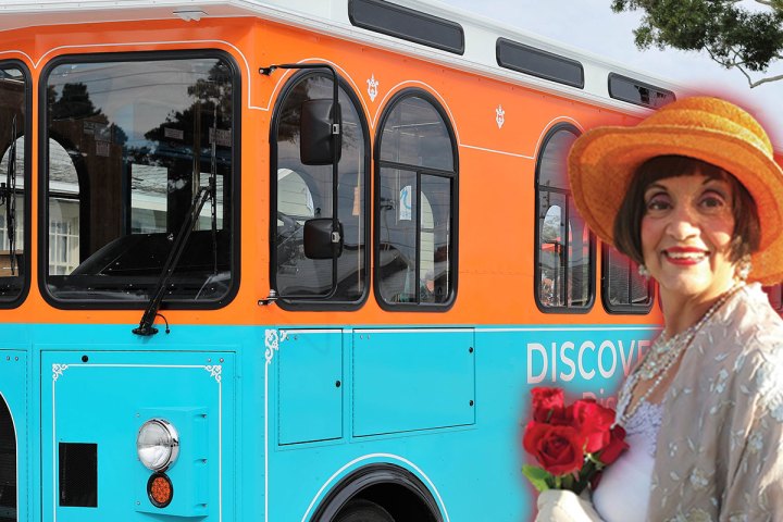 a person standing in front of a bus