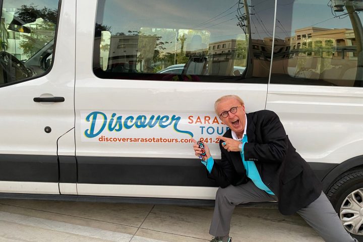 a person standing in front of a car