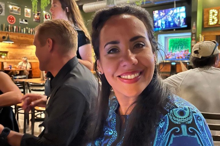 a woman standing in front of a store