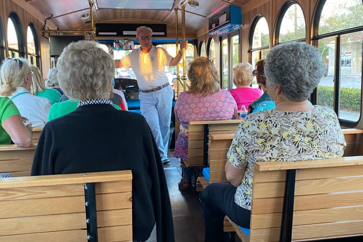 a group of people sitting on a bench