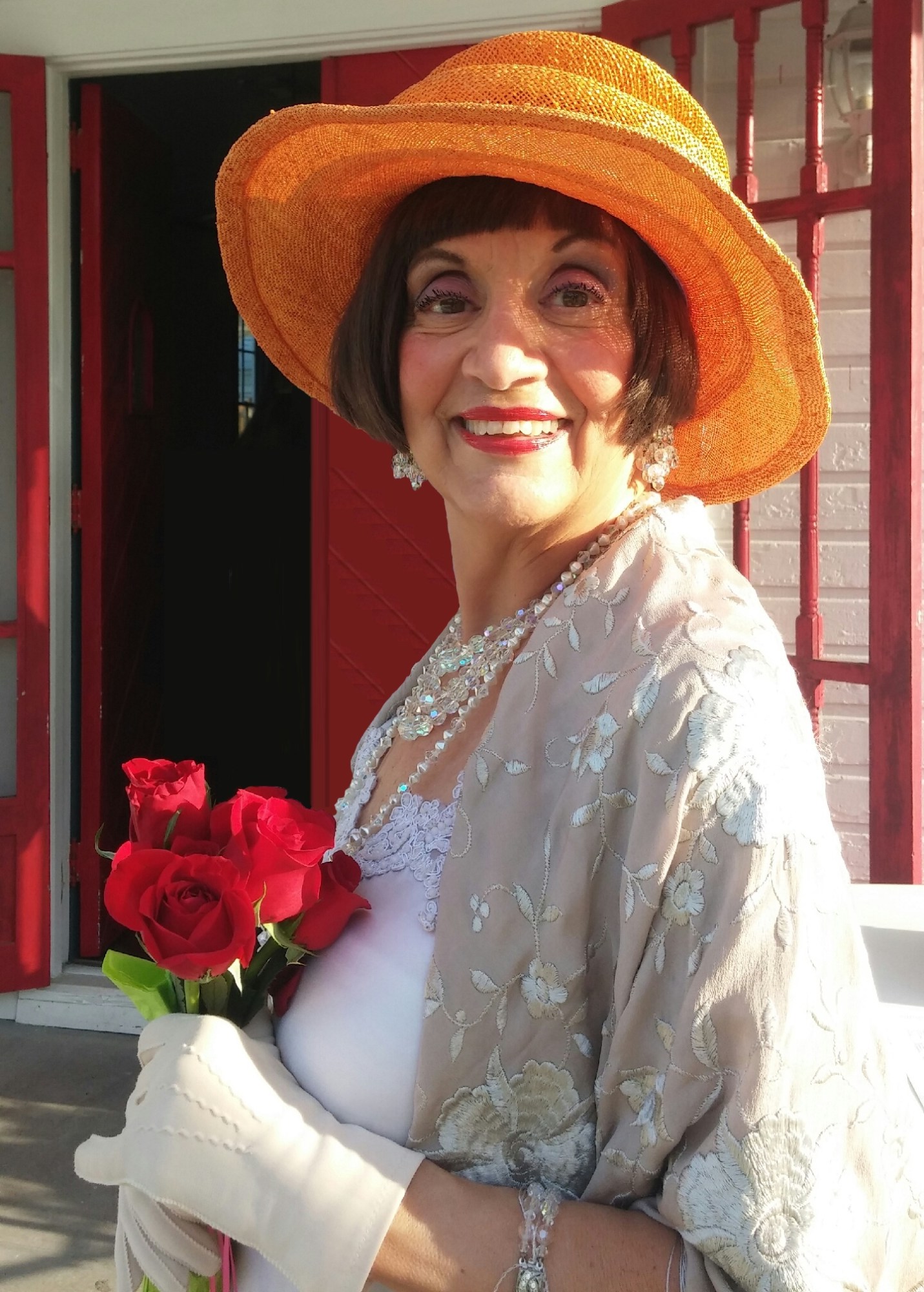 Kathryn-Chesley-as-Mable-Ringling-2_cropped-fixed a woman wearing a red hat