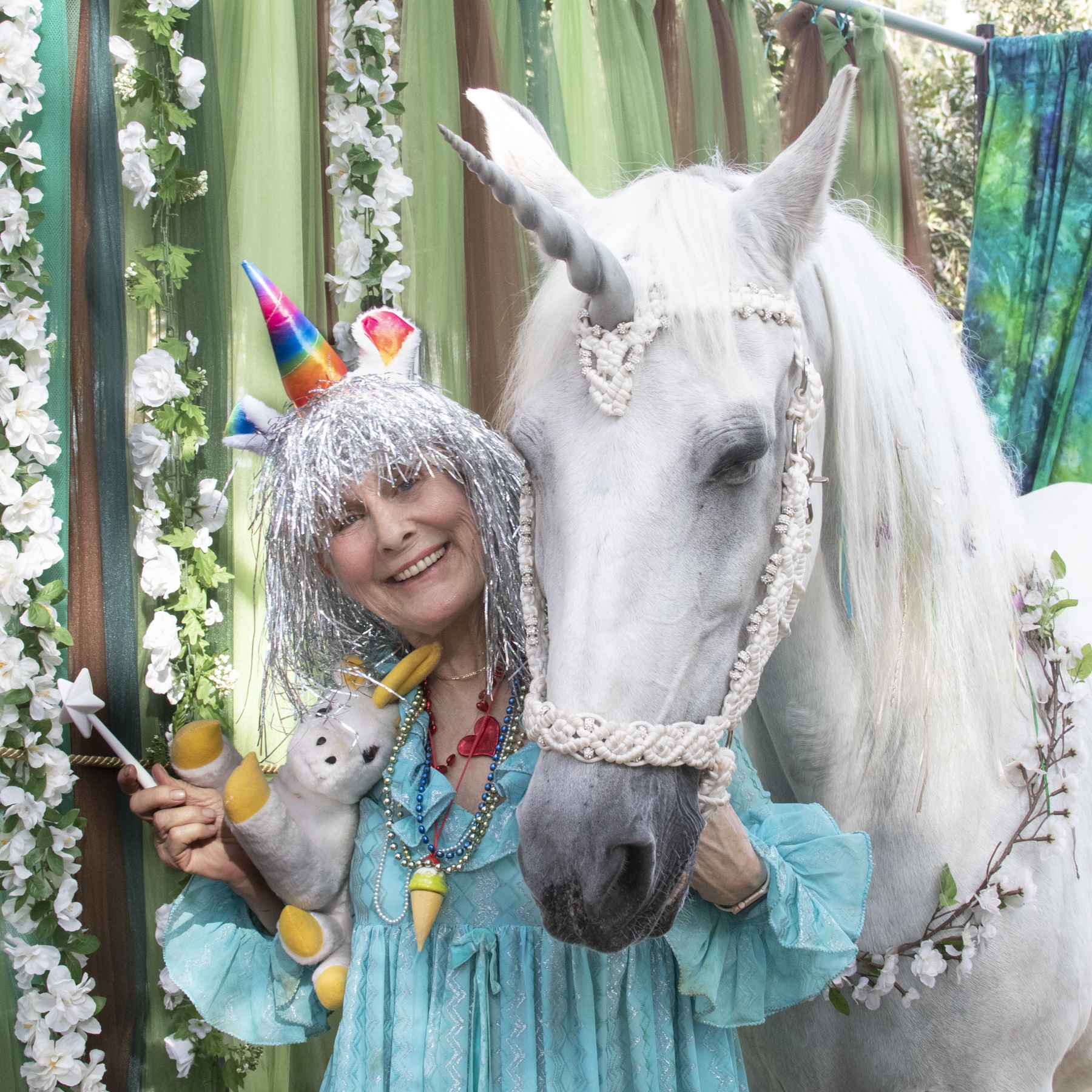 Unicorn-Granny-1 a person standing in front of a statue