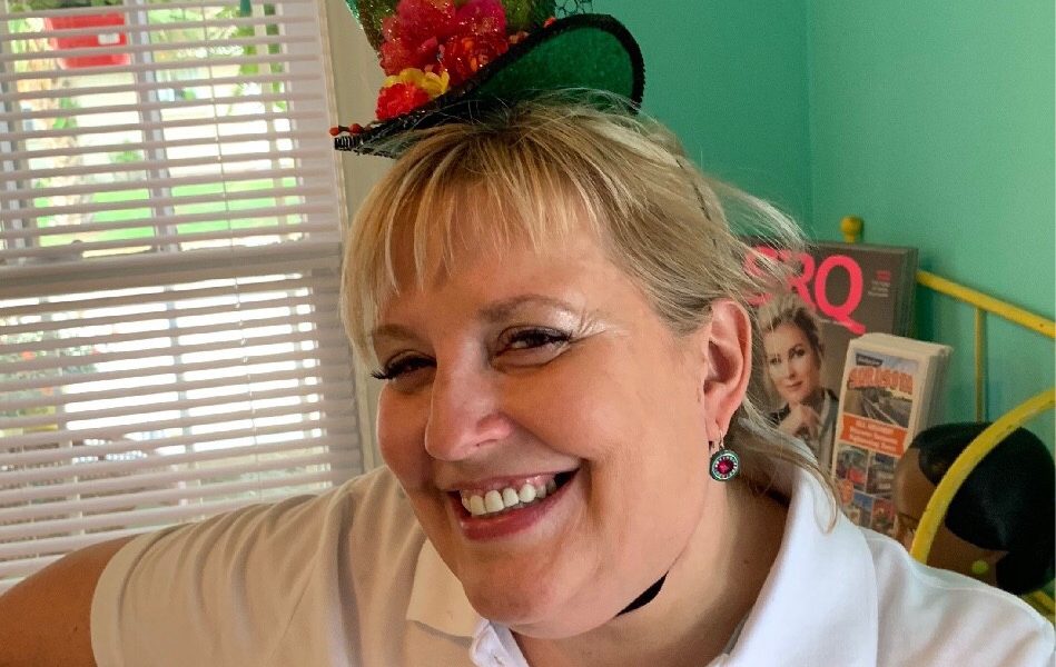 c-PersonalTamaraHauser__Tammy-with-little-green-hat_1608749831853-949×600 a person posing for the camera