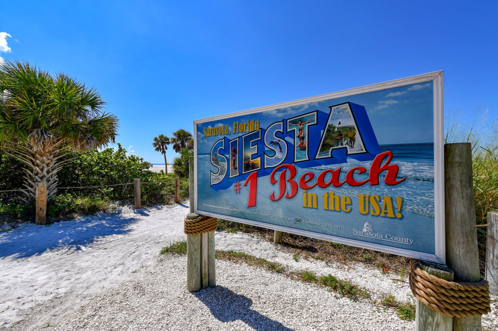 Siesta-Key-Beach-01-scaled a sign on a pole