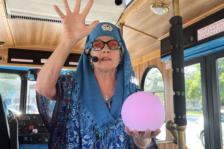 a person standing in front of a car