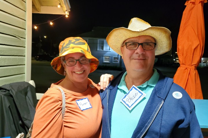 a man and a woman wearing a hat