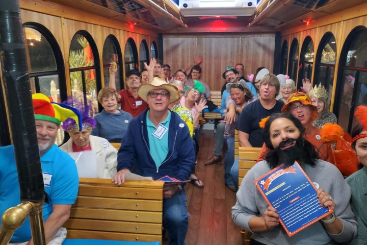 a group of people sitting at a train station