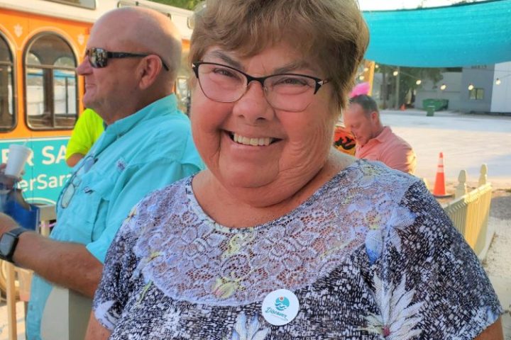 a man and a woman looking at the camera