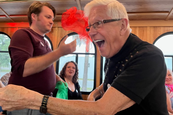 a man and a woman looking at the camera