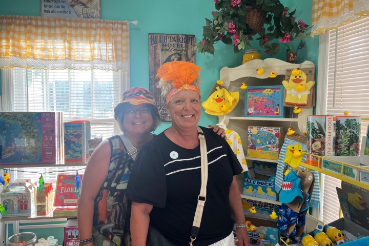 a man and a woman standing in front of a store