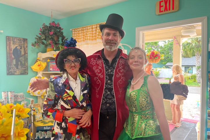 a woman standing in front of Jay O. Sanders et al. posing for the camera