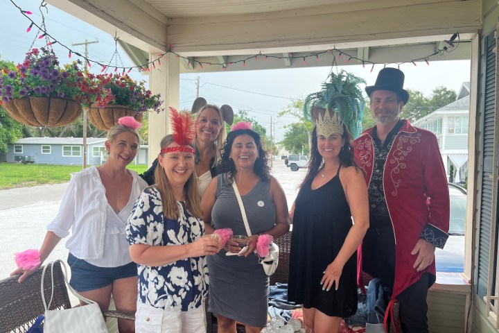 group of MURDER trolley guests posing for the camera in costume