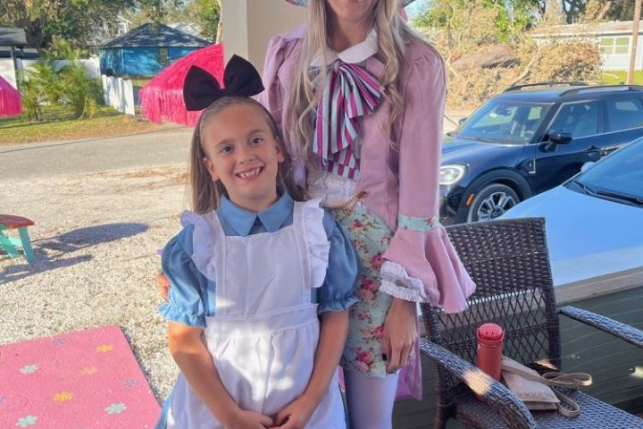 a person holding a little girl posing for a picture