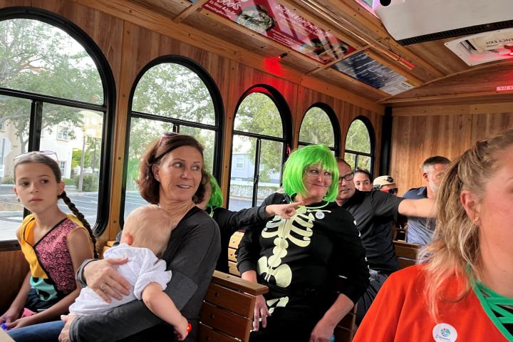 a group of people holding wine glasses