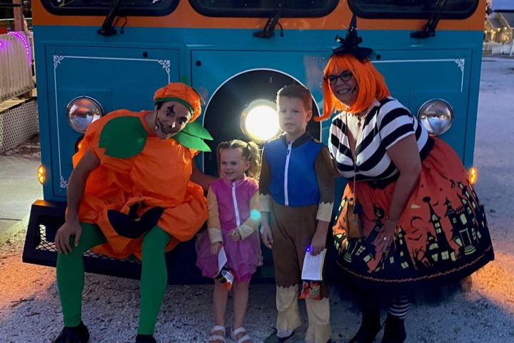 Pumpkin and WitchyPoo with kids in Halloween costumes
