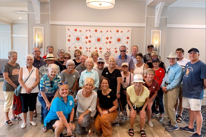 Mariam Nour et al. standing in a room