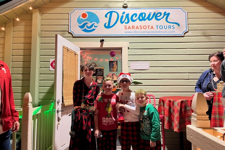 a group of people standing in front of a building