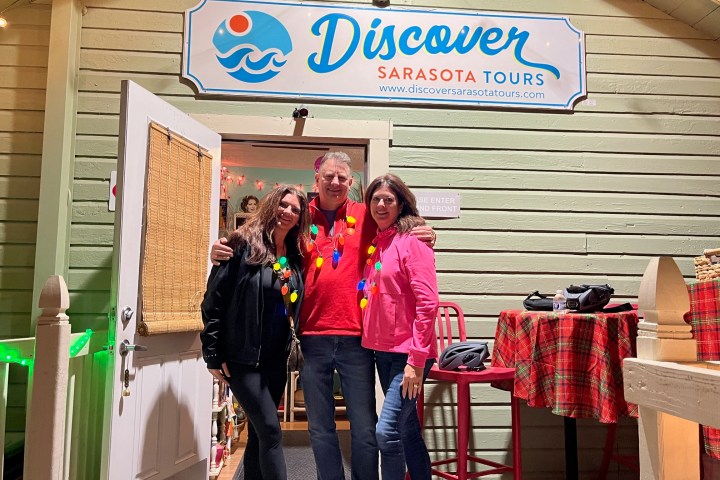 a man and a woman standing in front of a store