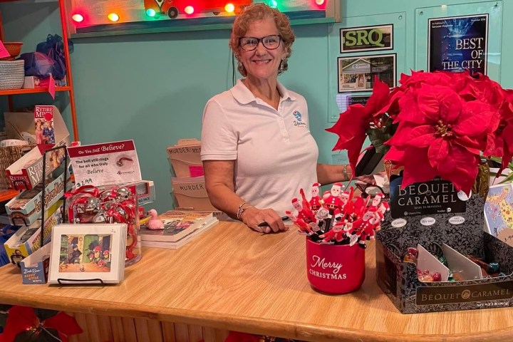a person standing in front of a store