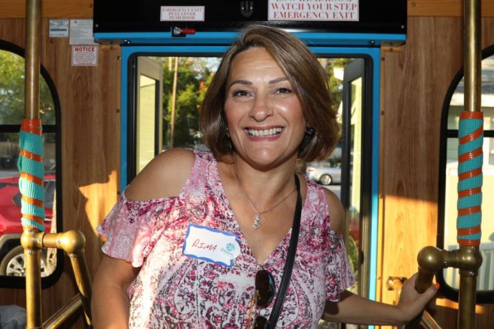 a person standing in front of a bus