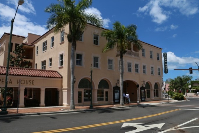 a building with a store on the corner of a street