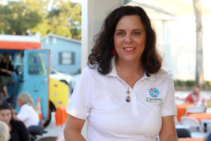 a person standing in front of a bus