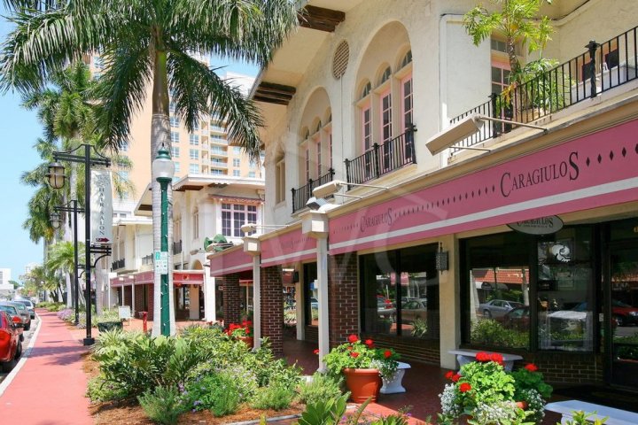 a building with a store on the side of the street