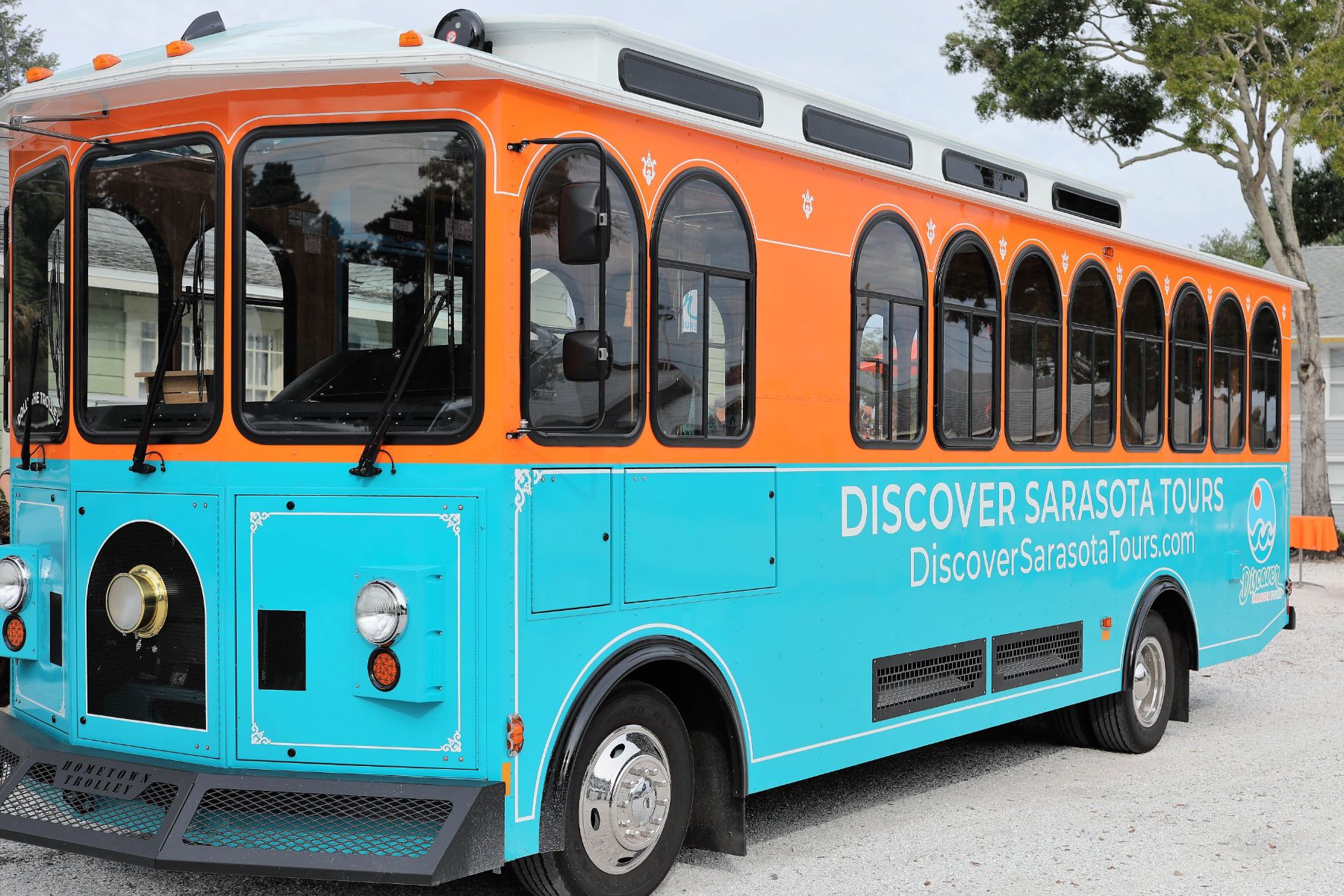 a blue bus parked in a lot