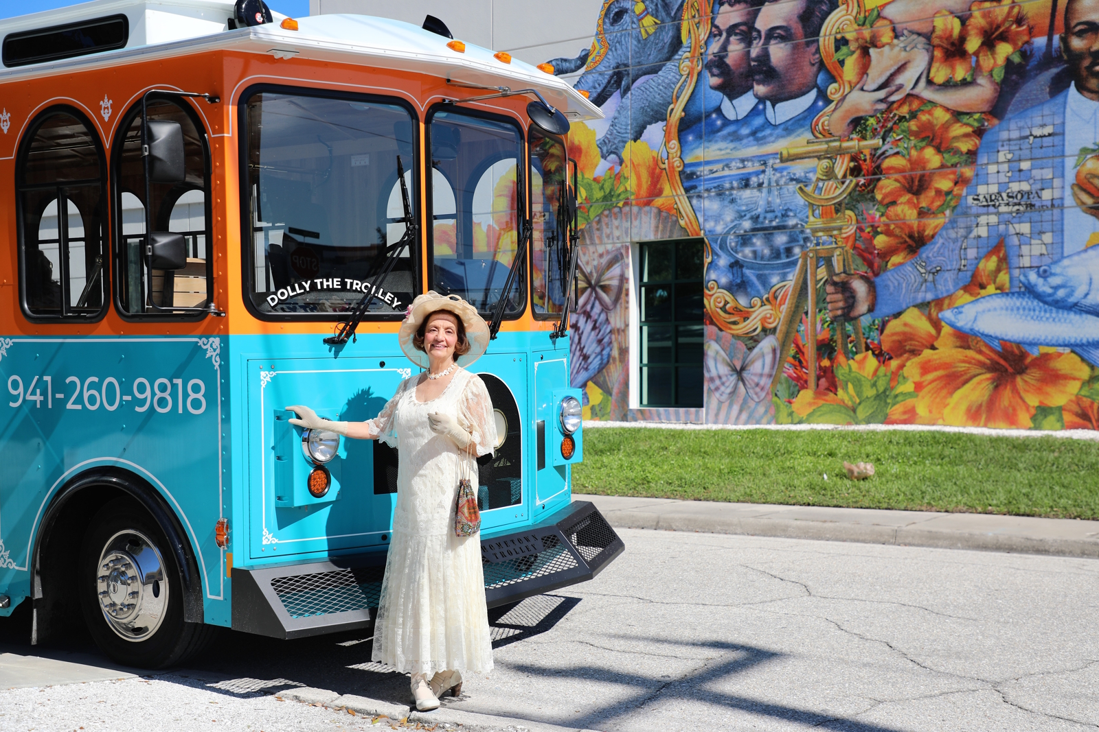 Kathryn-as-Leading -Ladies_1600x1067-120dpi a person standing in front of a bus