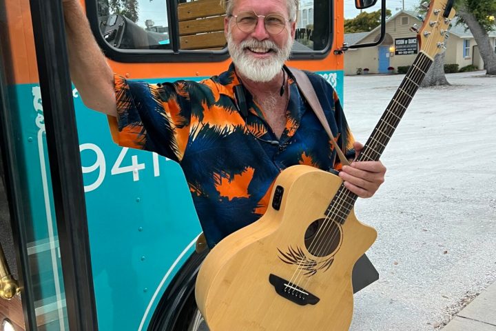 a man holding a guitar