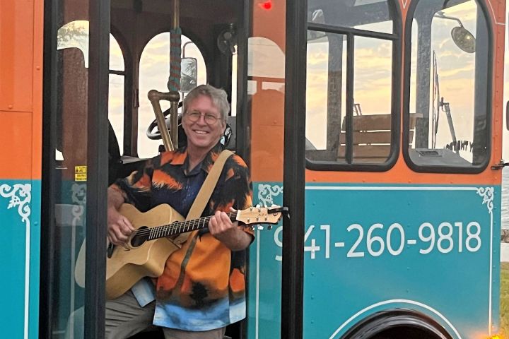a person standing in front of a bus