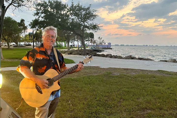 a man holding a guitar