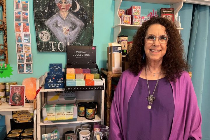 a person standing in front of a store