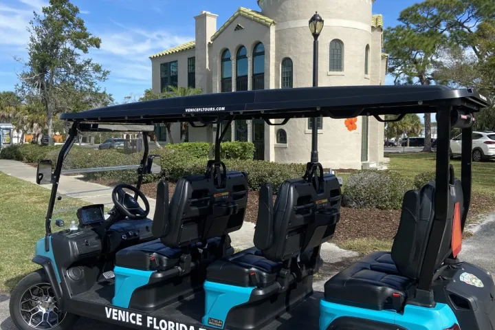 a group of people riding on the back of a truck