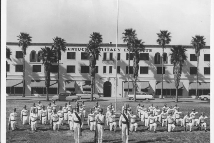 a group of people standing in front of a building