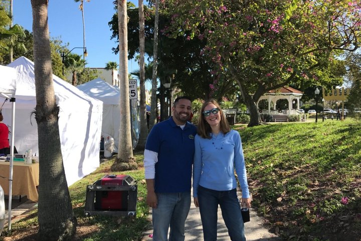 a person standing next to a tree