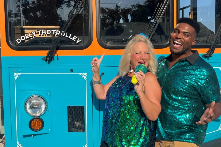 a person standing in front of a bus