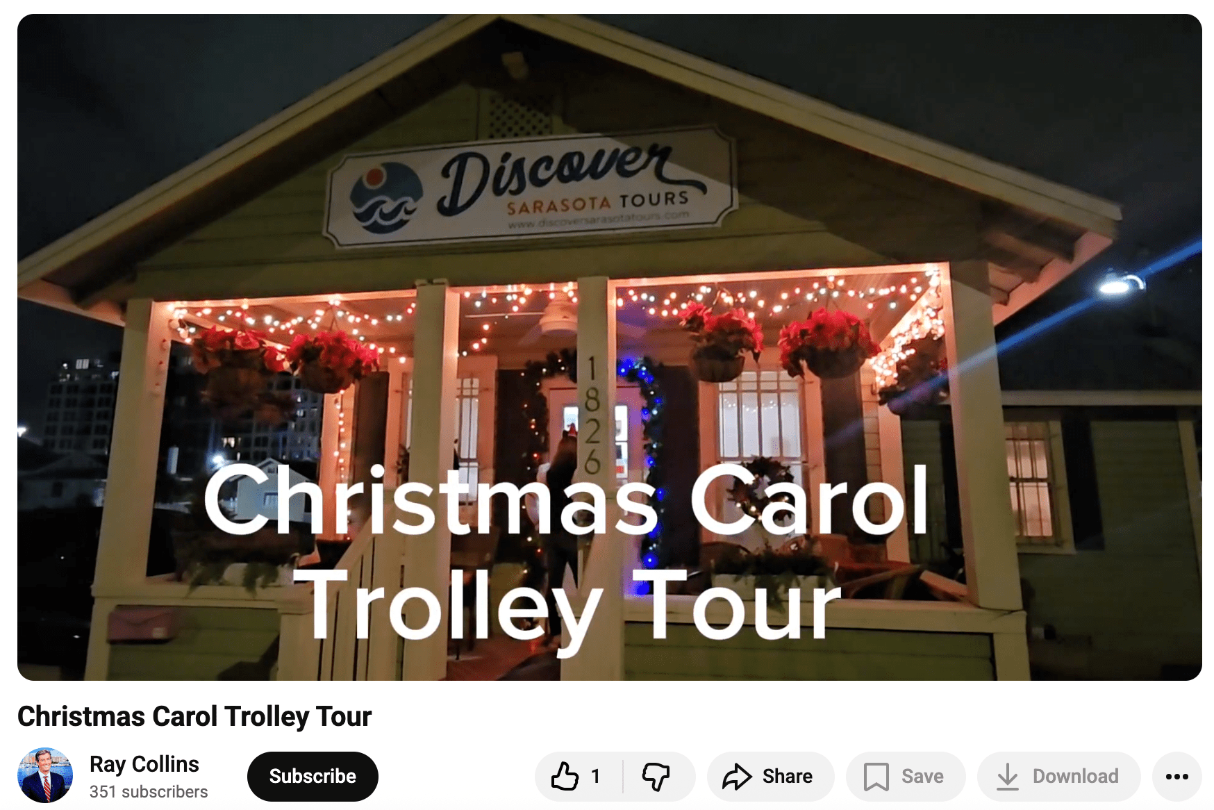 Festively lit house labeled 'Discover Sarasota Tours' promoting a Christmas Carol Trolley Tour.